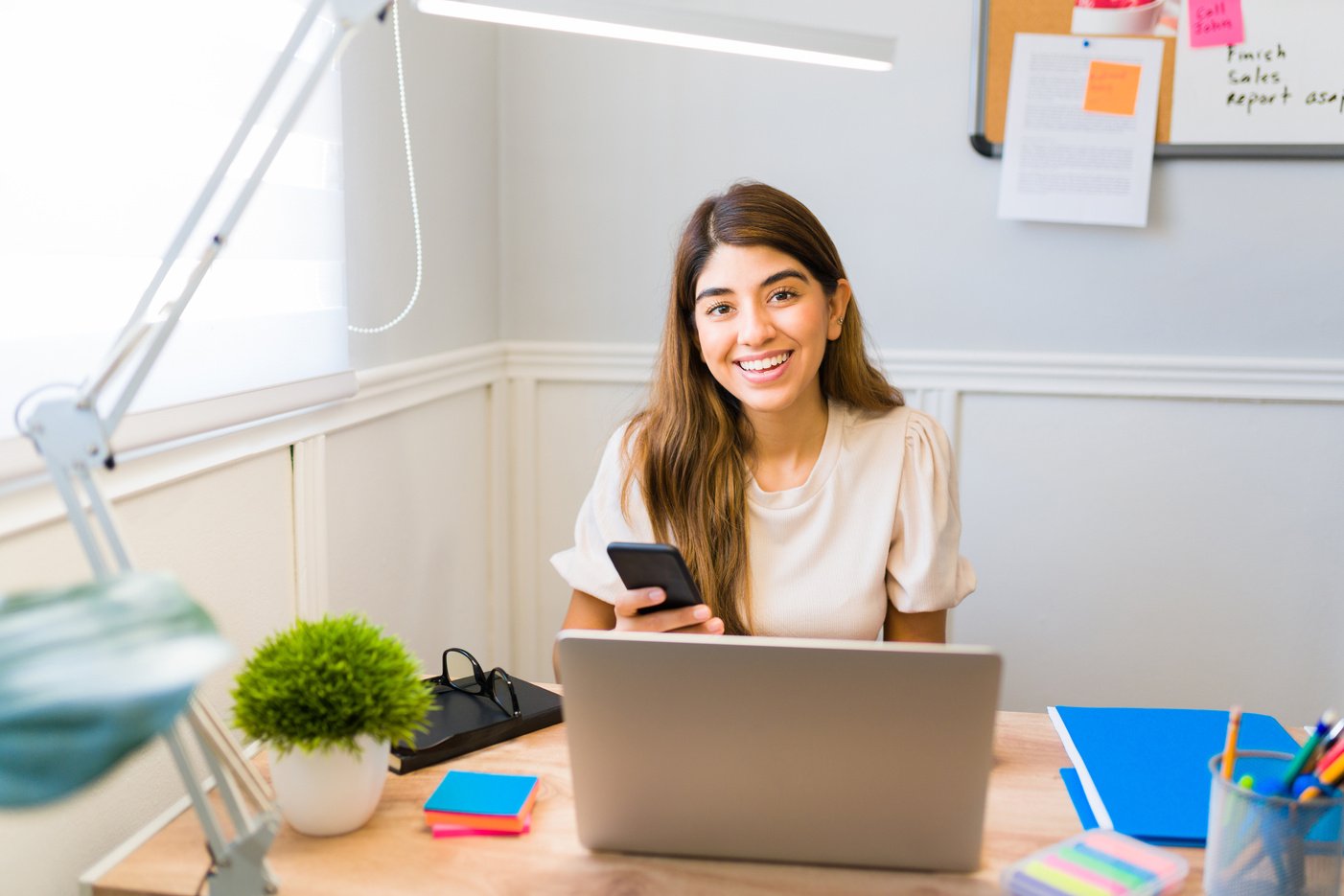 Beautiful woman feeling excited during her virtual assistant work